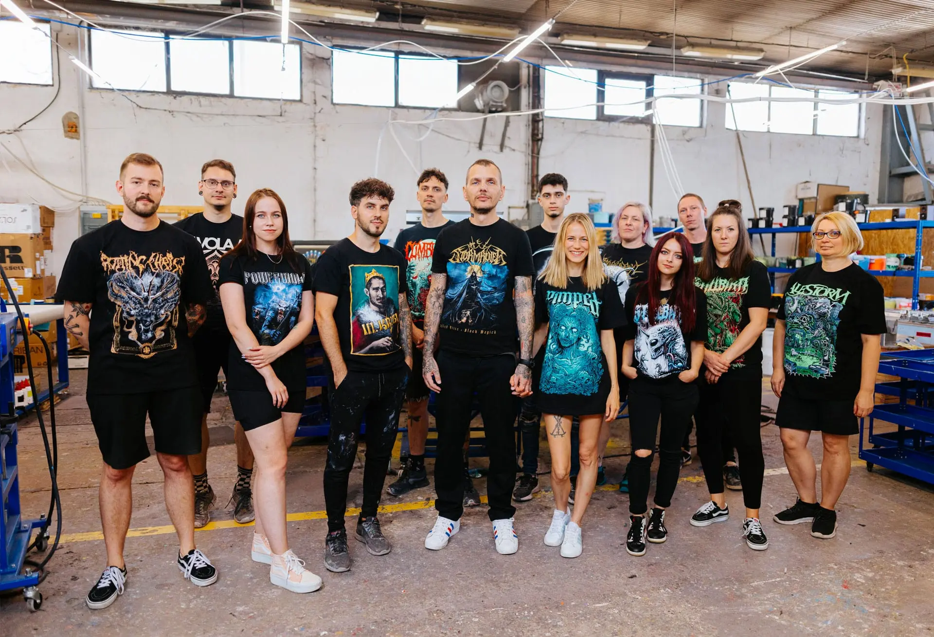 Real Pimp team of 13 screen printing professionals in Budapest workshop with band merchandise