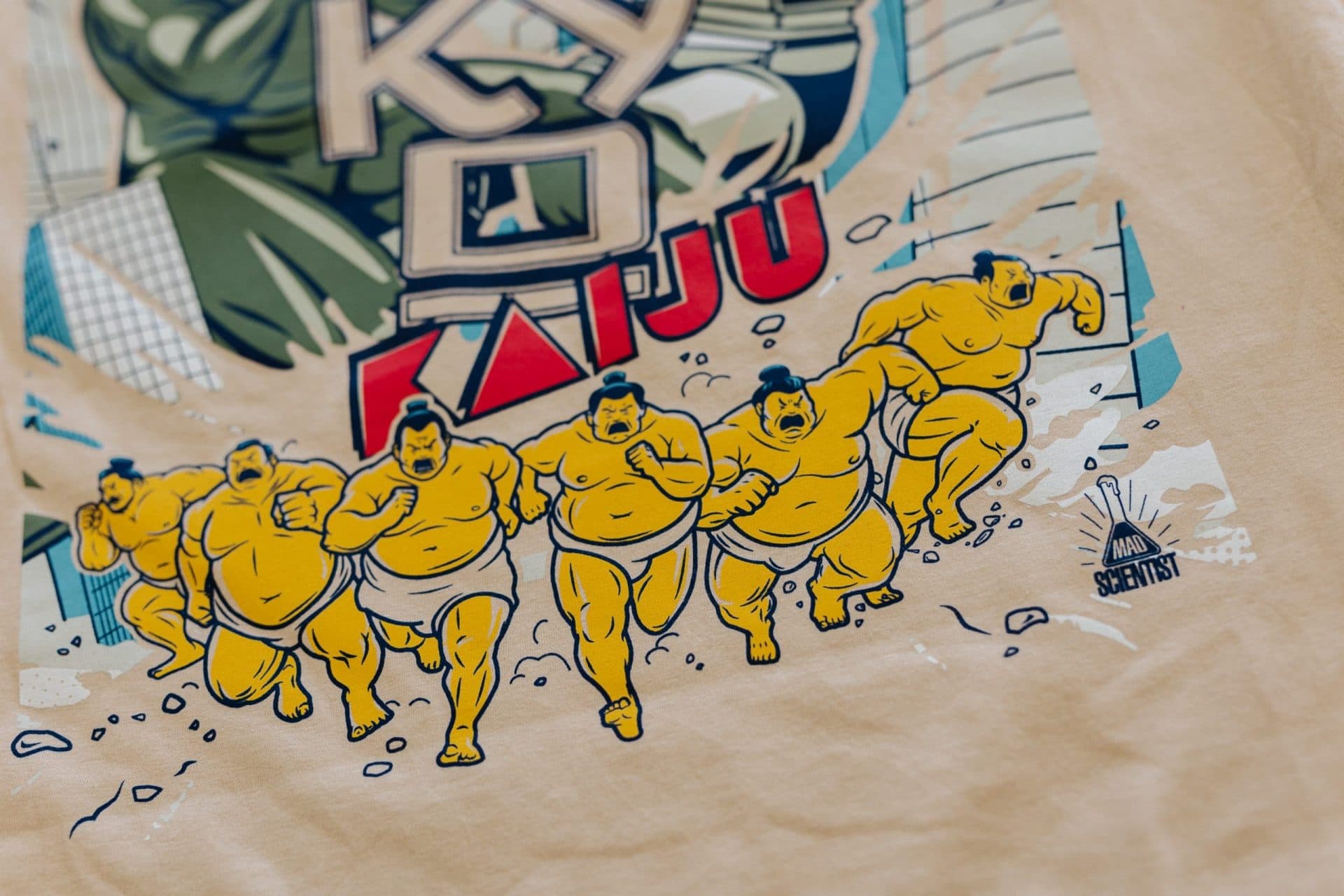 KAIJU brand t-shirt design featuring humorous illustrated characters for custom merchandise